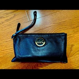 Fashionable Michael Kors black Wristlet.